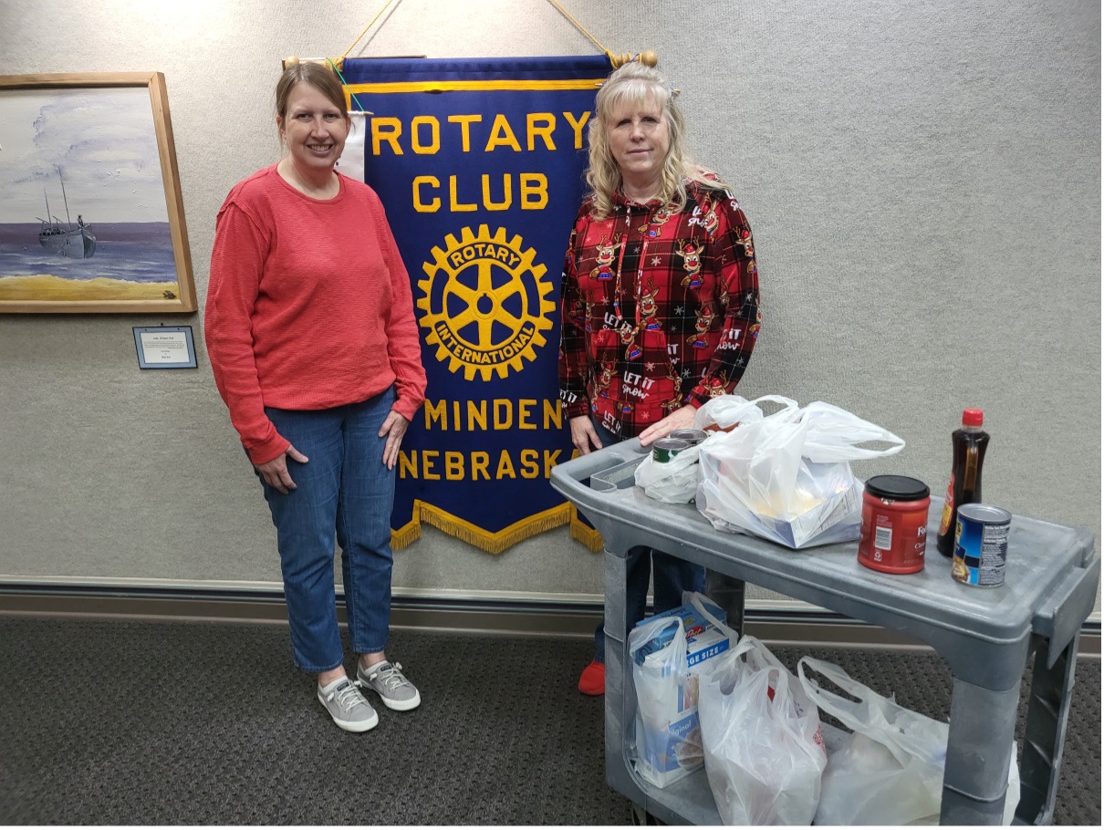 Members of The Rotary Club of Minden celebrated the Christmas season by gathering bags of food to donate to The Closet and Food Pantry of Minden